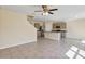 Open-concept layout connecting the living room to the kitchen and dining area with tile floors at 39 Hickory Course Way, Ocala, FL 34472