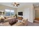 Comfortable living room with ample seating, a large window, and neutral color palette at 39 Hickory Course Way, Ocala, FL 34472