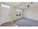 Welcoming living room with a neutral color palette, carpet floors, and natural light at 39 Hickory Course Way, Ocala, FL 34472