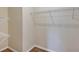Walk-in closet equipped with shelving and carpeted flooring offering ample storage space at 39 Hickory Course Way, Ocala, FL 34472