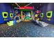 The building includes a colorful arcade and recreation room with vibrant decor and gaming options at 394 Captiva Dr, Davenport, FL 33896