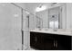 Bathroom featuring a modern double sink, a glass shower, and white subway tile at 394 Captiva Dr, Davenport, FL 33896