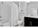 Well-lit bathroom featuring a shower with white subway tile, a toilet, and a modern sink at 394 Captiva Dr, Davenport, FL 33896