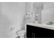 Modern bathroom with a white countertop, dark cabinets, and neutral wall color offers a clean, stylish aesthetic at 394 Captiva Dr, Davenport, FL 33896