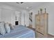 Bedroom featuring a double closet and a large wooden cabinet at 394 Captiva Dr, Davenport, FL 33896