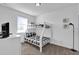 Shared bedroom with a white ladder and bunk beds, ideal for or guests at 394 Captiva Dr, Davenport, FL 33896
