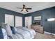 Cozy bedroom featuring stylish decor, a comfortable bed, and ample closet space at 394 Captiva Dr, Davenport, FL 33896