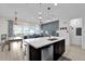 Open-concept living room with kitchen featuring dining area and comfortable seating at 394 Captiva Dr, Davenport, FL 33896
