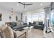 Bright, open living room with comfortable seating and sliding doors leading to the outside at 394 Captiva Dr, Davenport, FL 33896