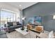 Relaxing living room featuring a comfortable couch and a view of the outdoor pool at 394 Captiva Dr, Davenport, FL 33896
