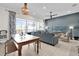 Bright living room featuring stylish decor, a comfortable seating area, and an outdoor view at 394 Captiva Dr, Davenport, FL 33896