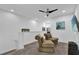Upstairs loft area featuring comfortable seating, a cozy atmosphere, and serene decor at 394 Captiva Dr, Davenport, FL 33896