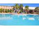 Enjoy the community pool with many chairs surrounding for a relaxing and luxurious vibe at 394 Captiva Dr, Davenport, FL 33896