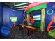 The recreation room offers ample seating and a large screen, creating an entertainment experience for all at 394 Captiva Dr, Davenport, FL 33896