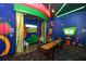 This recreation room features colorful decor, games, and a lounge area for entertainment and relaxation at 394 Captiva Dr, Davenport, FL 33896