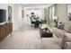 Open-concept living space with modern furnishings including the living room, dining room and kitchen at 4969 Kaia Ave, Winter Haven, FL 33884