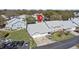 Aerial view of the Coach Homes at Dover Village featuring townhouses, parking, and lush greenery at 5273 Tunbridge Wells Ln # 1601, Orlando, FL 32812