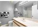 Bathroom with a white sink, decorative towels, toilet, and glass-enclosed shower at 5273 Tunbridge Wells Ln # 1601, Orlando, FL 32812
