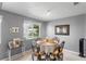 Charming dining area with a round table, elegant chairs, and plenty of natural light at 5273 Tunbridge Wells Ln # 1601, Orlando, FL 32812