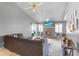 Cozy living room featuring a brick fireplace, plush sofa, and sliding glass doors at 5273 Tunbridge Wells Ln # 1601, Orlando, FL 32812