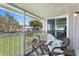 Screened patio showcasing comfortable seating and scenic outdoor views at 5273 Tunbridge Wells Ln # 1601, Orlando, FL 32812