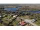 Aerial view of homes in the community situated amongst verdant landscaping and a beautiful blue waterway at 612 Via Isabelle Dr, Debary, FL 32713