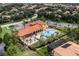 Aerial of the community clubhouse, pool, and surrounding homes, showcasing the well-maintained neighborhood at 612 Via Isabelle Dr, Debary, FL 32713