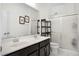This bathroom features a double sink vanity and glass-enclosed shower, offering a modern and functional design at 612 Via Isabelle Dr, Debary, FL 32713