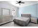 This bedroom features a soothing color scheme, a ceiling fan, and plenty of natural light for a peaceful environment at 612 Via Isabelle Dr, Debary, FL 32713