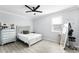 This bedroom is bright and airy with a full-length mirror and a ceiling fan, maximizing space and comfort at 612 Via Isabelle Dr, Debary, FL 32713