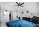 This bedroom offers ample storage with an open closet and features a ceiling fan for added comfort at 612 Via Isabelle Dr, Debary, FL 32713
