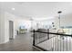 Upstairs bonus room with natural light, neutral colors, plank floors and plenty of space for relaxing or entertaining at 612 Via Isabelle Dr, Debary, FL 32713