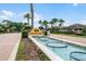 Elegant community entrance with manicured landscaping, a fountain, and secure gated access at 612 Via Isabelle Dr, Debary, FL 32713