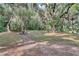 Picturesque park area featuring walking path, picnic tables and mature trees in Riviera Bella community at 612 Via Isabelle Dr, Debary, FL 32713