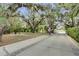 Picturesque park area featuring walking path, picnic tables and mature trees in Riviera Bella community at 612 Via Isabelle Dr, Debary, FL 32713