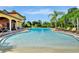 Beautiful community pool area featuring ample seating and water features, ideal for leisure at 612 Via Isabelle Dr, Debary, FL 32713