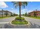 Scenic view of the street showcasing the well-maintained landscaping and upscale homes in Riviera Bella community at 612 Via Isabelle Dr, Debary, FL 32713