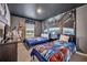Star Wars themed bedroom with twin beds, robot decor, and space themed wall art at 638 Ogelthorpe Dr, Davenport, FL 33897