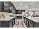 Well-lit kitchen with granite counters, stainless steel appliances, and open design to dining area at 638 Ogelthorpe Dr, Davenport, FL 33897