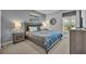 Cozy bedroom with a comfortable queen-size bed, soft lighting, and a window view at 638 Ogelthorpe Dr, Davenport, FL 33897