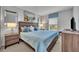 Serene main bedroom featuring a comfortable king-size bed, soft lighting, and stylish decor at 638 Ogelthorpe Dr, Davenport, FL 33897