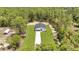 Areal view shows a new construction home on a spacious lot, backing up to Florida wilderness at 7007 Sw 131St Ave, Ocala, FL 34481