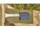 A top-down aerial of the property showing the driveway, lawn, and treeline at 7117 Sw 131St Ave, Ocala, FL 34481