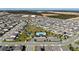 Wide aerial view of a residential community featuring a community pool and playground at 760 Annabell Ridge Rd, Minneola, FL 34715