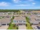 Spacious home with a three-car garage and paver driveway is nestled in a well-planned community with manicured lawns at 760 Annabell Ridge Rd, Minneola, FL 34715