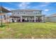 Spacious backyard features a covered patio, outdoor kitchen and play area at 760 Annabell Ridge Rd, Minneola, FL 34715