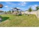 Large backyard with jungle gym and playset offering ample space for outdoor activities at 760 Annabell Ridge Rd, Minneola, FL 34715