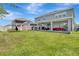 Spacious backyard features a covered patio, outdoor kitchen and play area at 760 Annabell Ridge Rd, Minneola, FL 34715