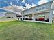 Large backyard featuring a built-in grill and covered patio at 760 Annabell Ridge Rd, Minneola, FL 34715