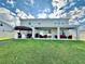 Spacious backyard featuring a covered patio and an outdoor kitchen at 760 Annabell Ridge Rd, Minneola, FL 34715